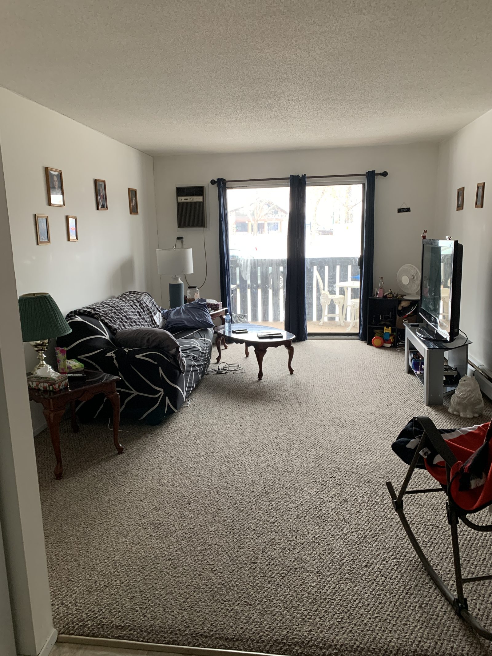 Living room before renovation at College Drive